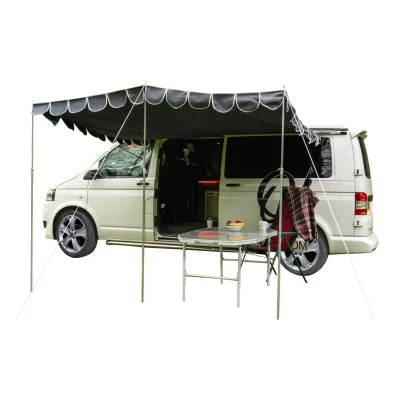 Isolated studio image of a VW campervan with the charcoal OLPRO Retro Shade canopy fully pitched, demonstrating the large footprint and classic scalloped design.