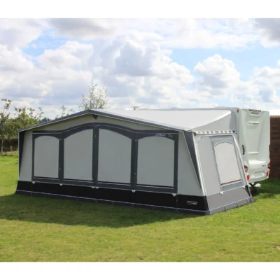 Camptech Atlantis DL Caravan Awning is pitched next to a caravan, sunny day camping