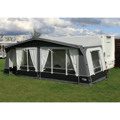 Camptech Kensington Caravan Awning is on grass under a clear sky perfect for camping